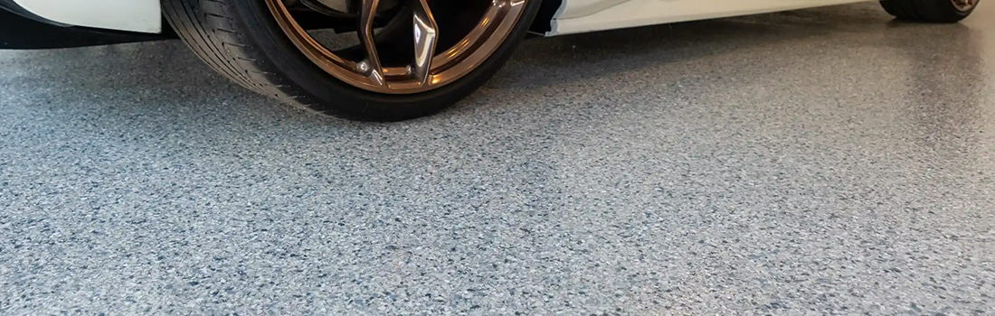 image of finished garage floor with car wheel resting on it