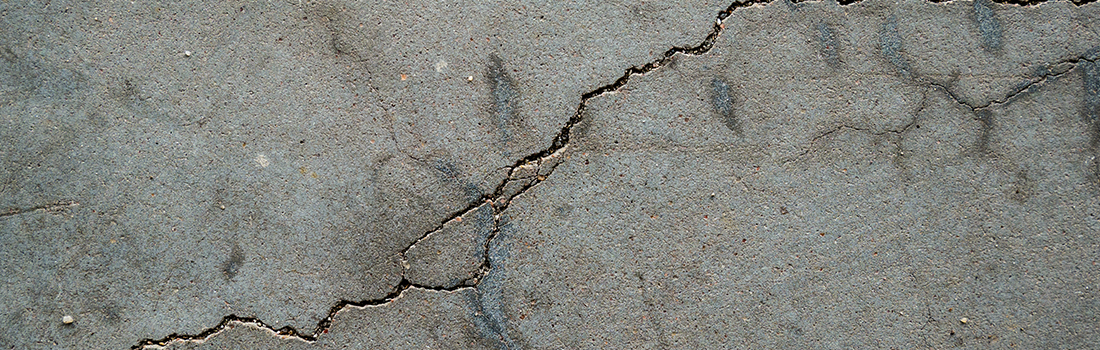 cracked, molding garage floor close-up